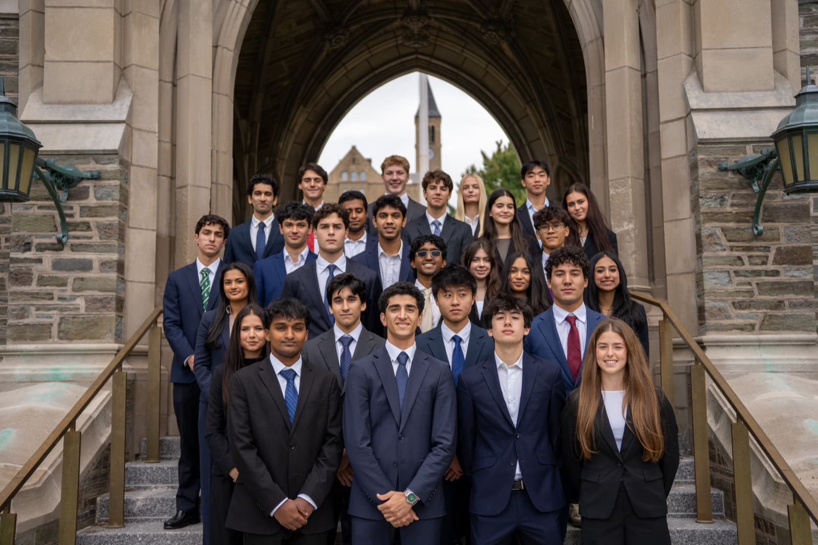 CPEC members outside an iconic Cornell archway